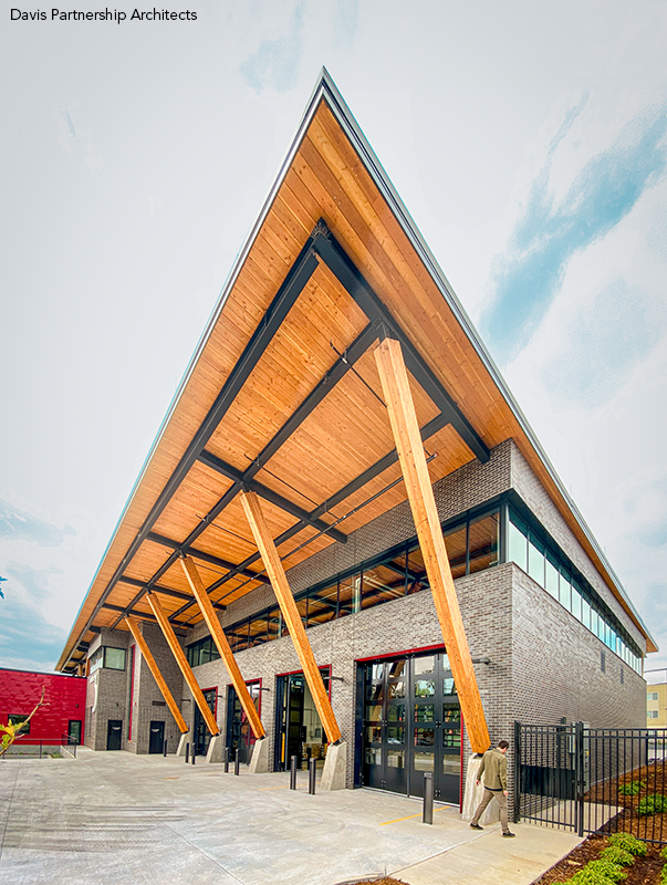 A steel frame supports the station's sweeping glue-laminated wood roof.